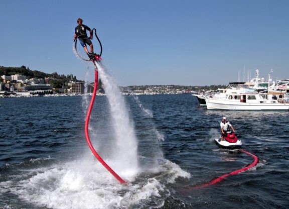 Charter guest onboard Luxury Motor Yacht 'Berzinc' trying the Flyboard
