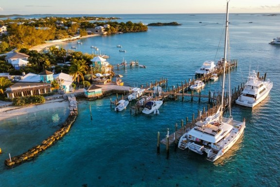 Catamaran and motor yachts docked at Staniel Cay Yacht Club in the Exumas, Bahamas