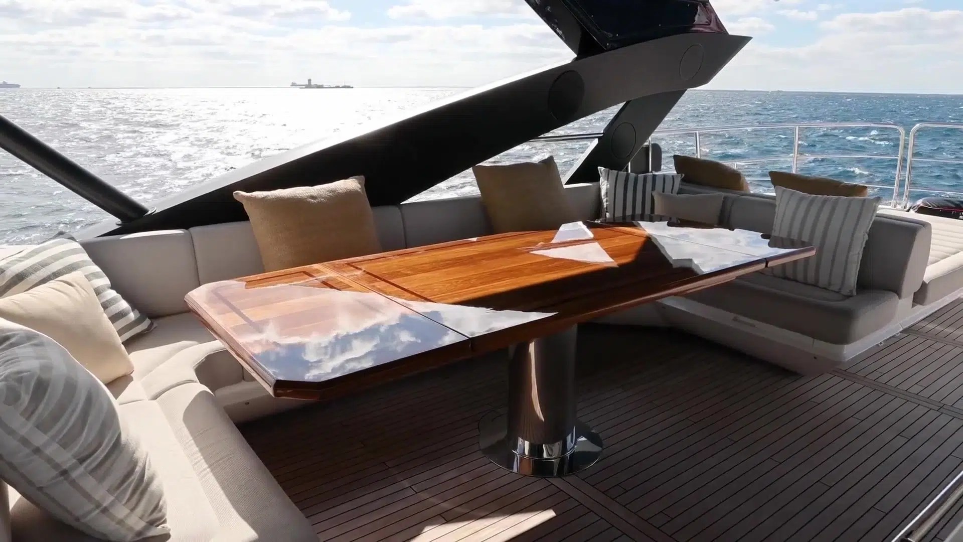 Shaded outdoor dining and lounge seating aboard GOLDEN OURS