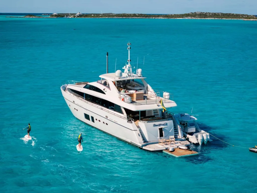BEACHFRONT II, a 105 foot Princess, at anchor in the Bahamas